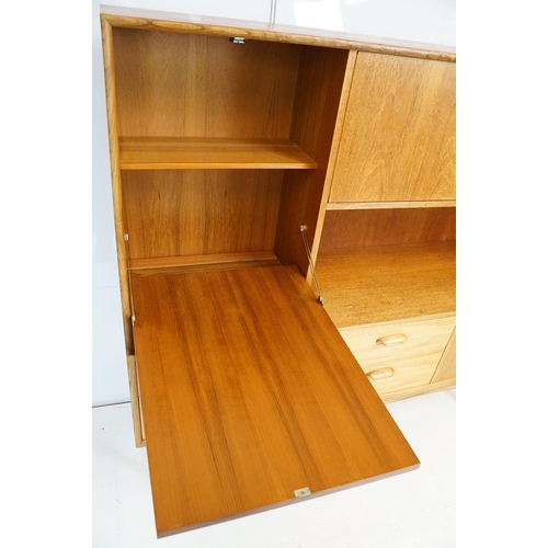 745 - G Plan teak sideboard, with cupboards above two long drawers and a further cupboard, with maker's la... 