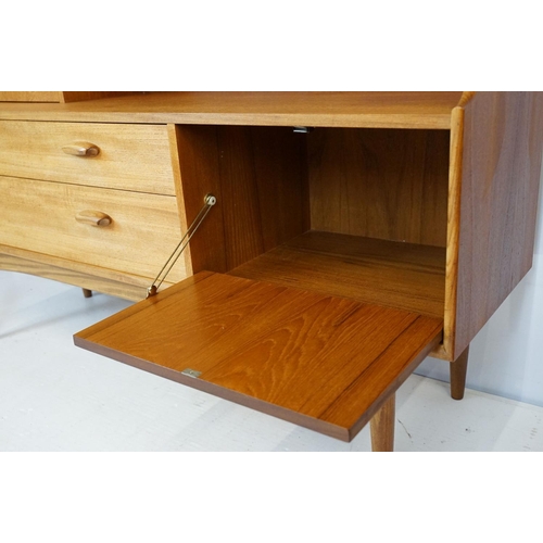 745 - G Plan teak sideboard, with cupboards above two long drawers and a further cupboard, with maker's la... 