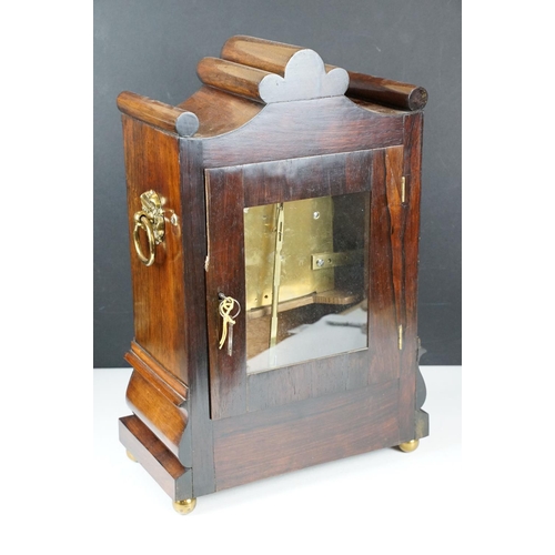 749 - G. T. Hinde, 3 Sekford St., Clerkenwell, mantel timepiece, with ornately carved rosewood case, with ... 