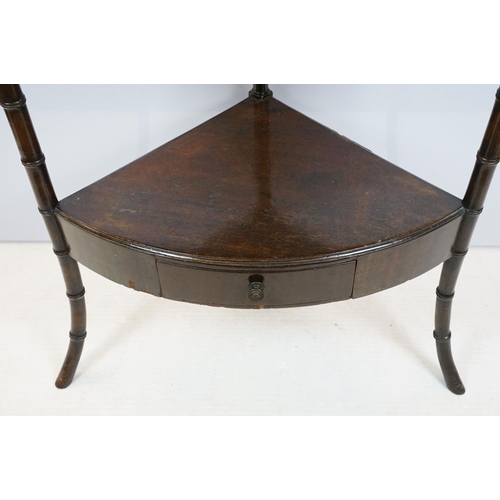 754 - Mahogany two tier table corner table, the legs carved to resemble bamboo, the bottom tier with centr... 