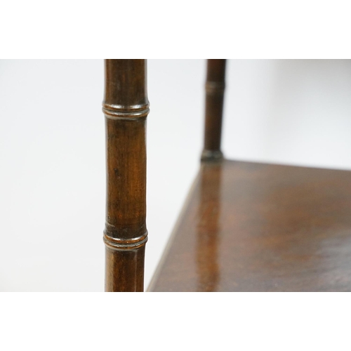 754 - Mahogany two tier table corner table, the legs carved to resemble bamboo, the bottom tier with centr... 