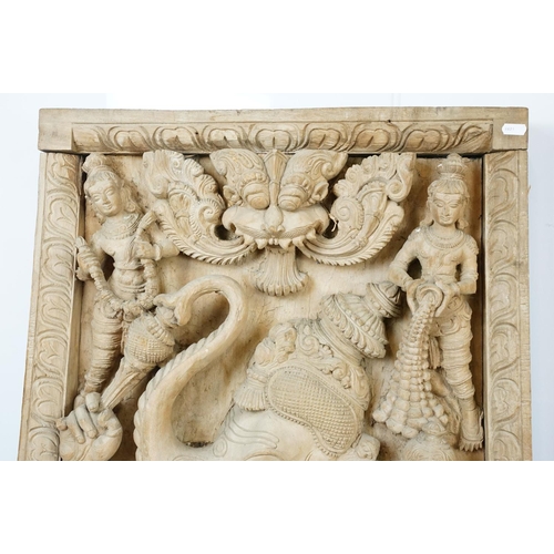 755 - Pair of large Indian carved wooden panels depicting Ganesh surrounded by various figures, each measu... 