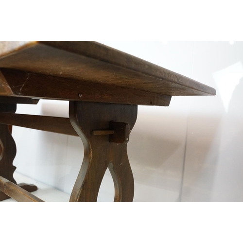 758 - 20th century oak table of lyre end stretchered form, 75cm high x 150.5cm wide x 75.5cm deep