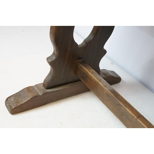 758 - 20th century oak table of lyre end stretchered form, 75cm high x 150.5cm wide x 75.5cm deep