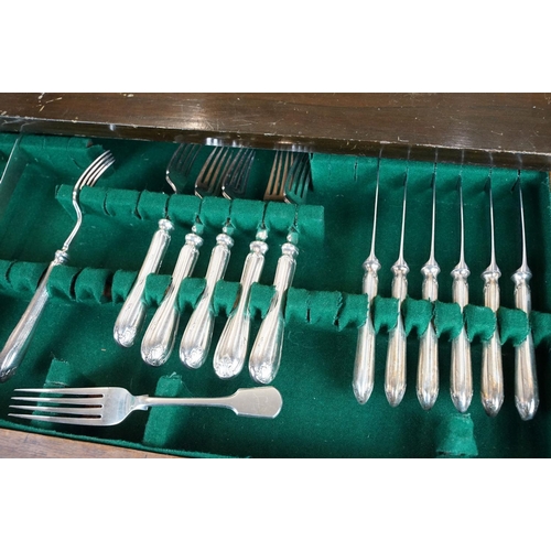 130 - Part canteen of Mappin & Webb silver plated cutlery, housed within a three drawer mahogany cabinet, ... 