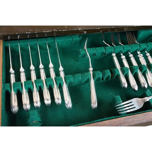 130 - Part canteen of Mappin & Webb silver plated cutlery, housed within a three drawer mahogany cabinet, ... 