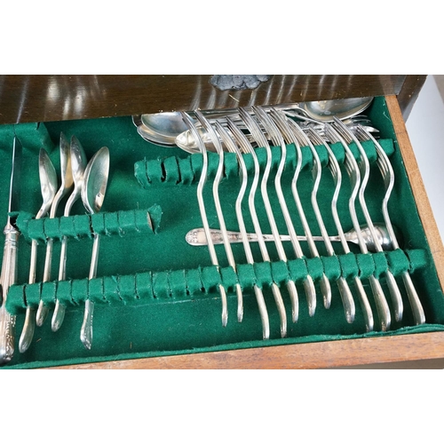 130 - Part canteen of Mappin & Webb silver plated cutlery, housed within a three drawer mahogany cabinet, ... 