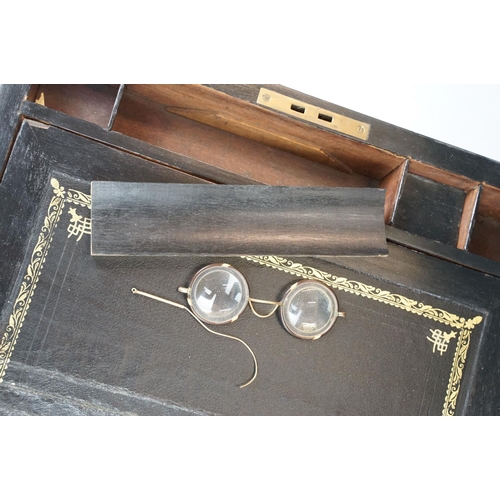 163 - Victorian brass bound walnut writing slope with vacant brass inlay to lid, opening to an interior wi... 