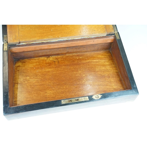 163 - Victorian brass bound walnut writing slope with vacant brass inlay to lid, opening to an interior wi... 