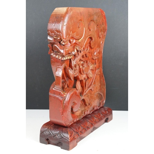 165 - Chinese red lacquered carved wooden sculpture depicting a grotesque mask, bird & flower, approx 43cm... 