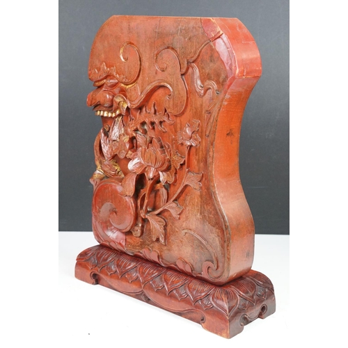 165 - Chinese red lacquered carved wooden sculpture depicting a grotesque mask, bird & flower, approx 43cm... 