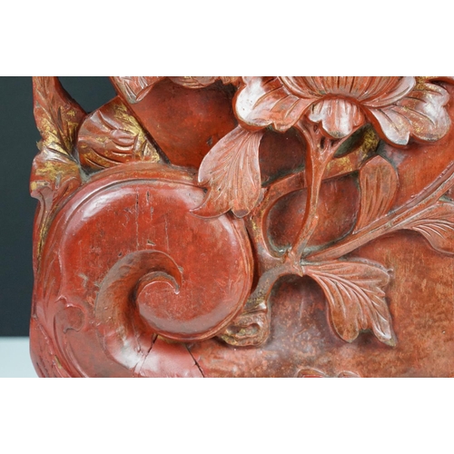 165 - Chinese red lacquered carved wooden sculpture depicting a grotesque mask, bird & flower, approx 43cm... 