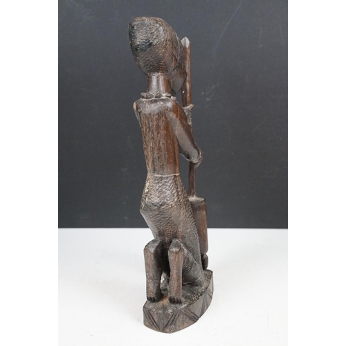 166 - Pair of African carved hardwood stylised figures, tallest approx 34cm