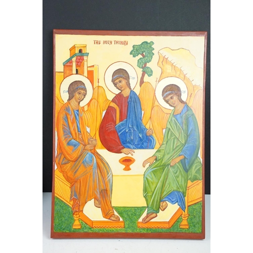 167 - Three painted wooden religious icons to include a gilt ground example (approx 41cm x 27cm)