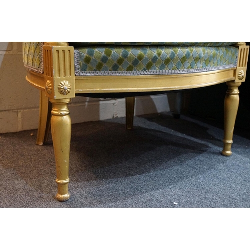 642 - Gilt framed French style armchair with floral motifs & upholstered seat cushion, raised upon four le... 