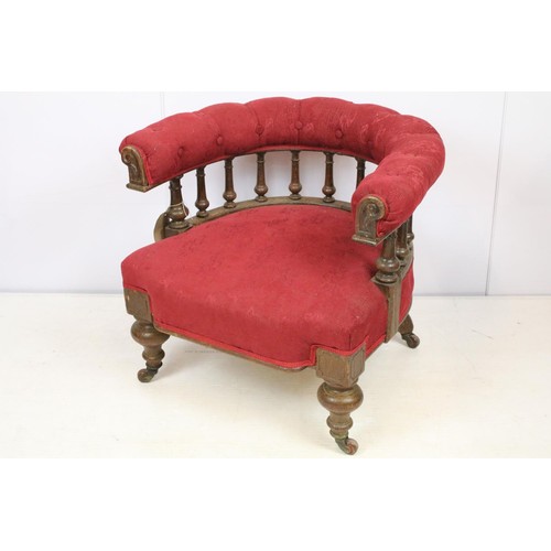 651 - Early 20th century oak framed tub armchair with button back above galleried turned supports, on turn... 