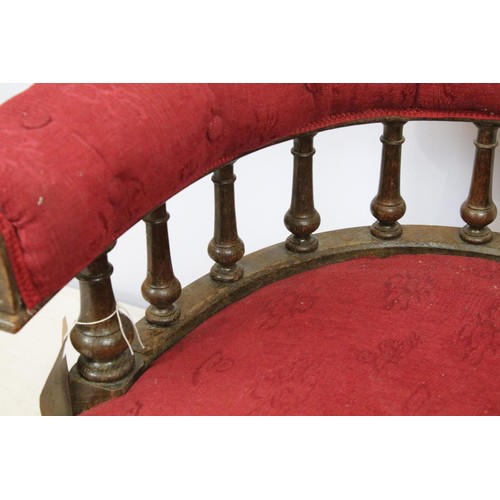 651 - Early 20th century oak framed tub armchair with button back above galleried turned supports, on turn... 