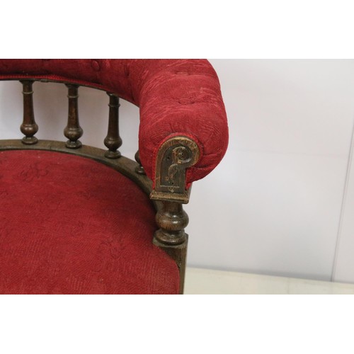 651 - Early 20th century oak framed tub armchair with button back above galleried turned supports, on turn... 