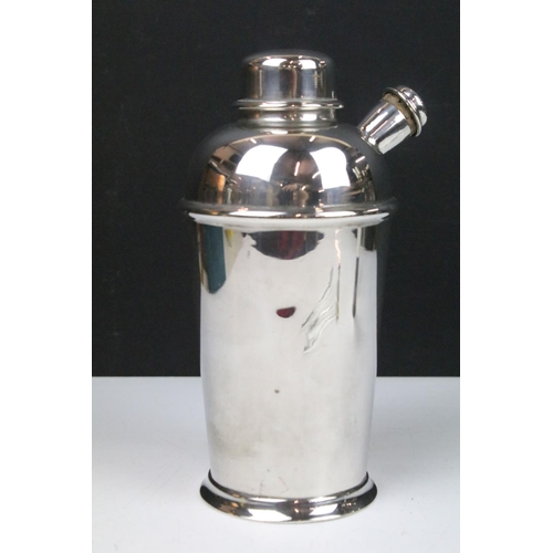 216 - An early to mid 20th century silver plated cocktail shaker together with measuring cup and a set of ... 