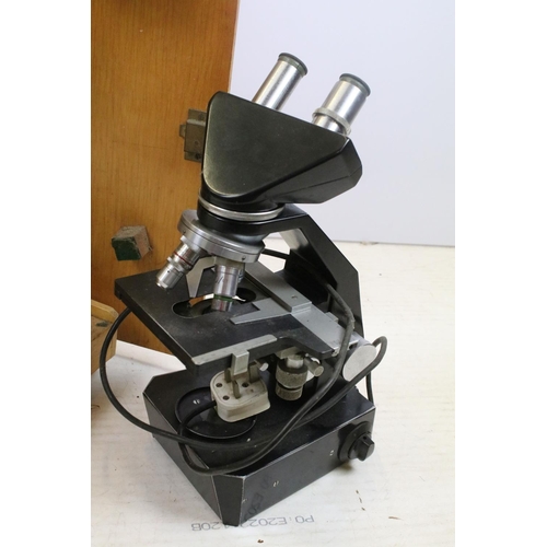 452 - Gillett & Sibert GS electric binocular microscope, numbered M27215, approx 40cm tall, housed within ... 