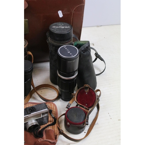 459 - Collection of cameras, lenses & binoculars within a leather case, the lot featuring Olympus FTL (wit... 