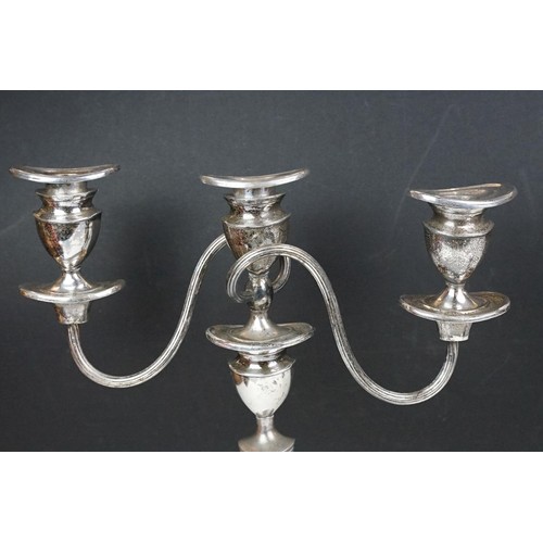 141 - Pair of silver plated three branch candelabra, each 29cm high