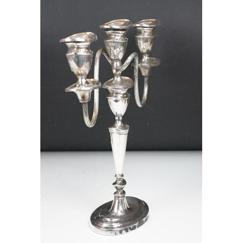 141 - Pair of silver plated three branch candelabra, each 29cm high