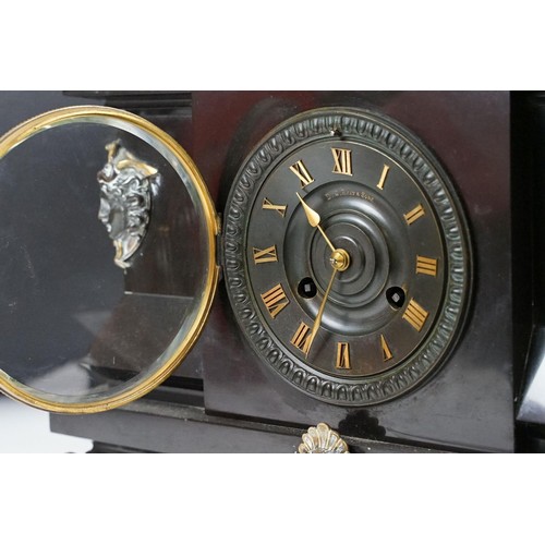 143 - Victorian slate mantel clock the dial with brass roman numerals, the case with classical masks and b... 