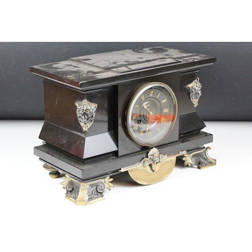 143 - Victorian slate mantel clock the dial with brass roman numerals, the case with classical masks and b... 