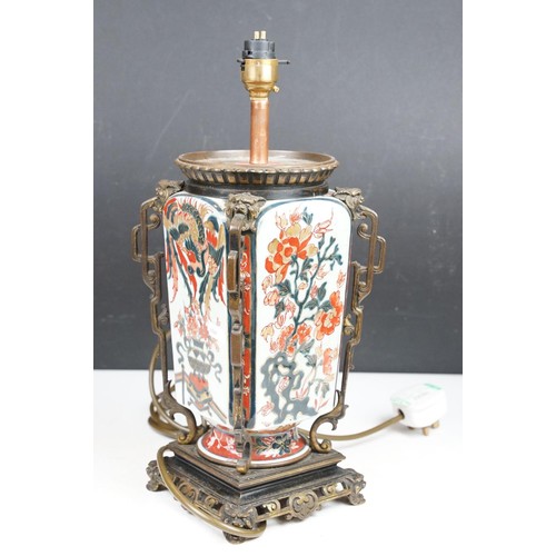 145 - Oriental ceramic table lamp decorated in the Imari palette (approx 38cm high), together with a pair ... 