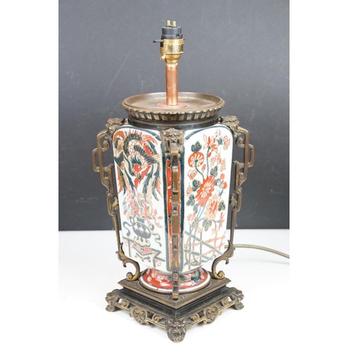 145 - Oriental ceramic table lamp decorated in the Imari palette (approx 38cm high), together with a pair ... 