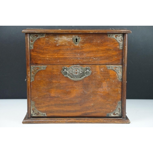 154 - Late 19th / early 20th century oak vanity box / cabinet, the lid and fall front lower compartment be... 