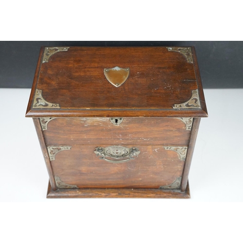 154 - Late 19th / early 20th century oak vanity box / cabinet, the lid and fall front lower compartment be... 