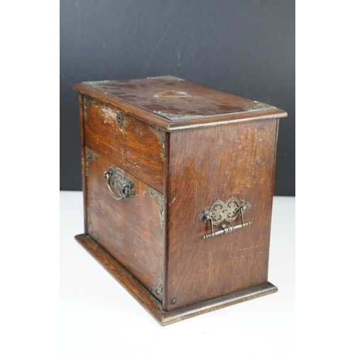 154 - Late 19th / early 20th century oak vanity box / cabinet, the lid and fall front lower compartment be... 