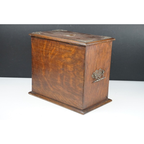 154 - Late 19th / early 20th century oak vanity box / cabinet, the lid and fall front lower compartment be... 