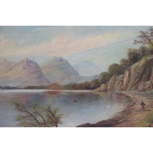 554 - Swept gilt framed 19th century oil on canvas, Highland Loch View with figure and man in a boat, date... 