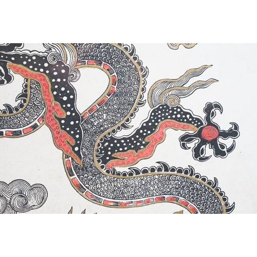 572 - Asian woodblock print on rice paper of a Chinese dragon, highlighted in gold and red, signed T. Muni... 