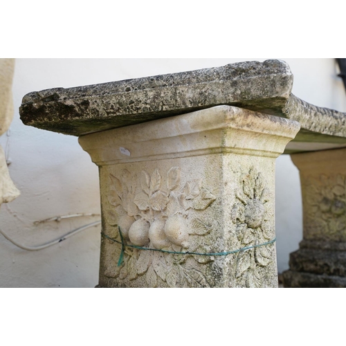 622 - Stone garden seat of curved form, raised on two supports with floral decoration in relief, approx 11... 