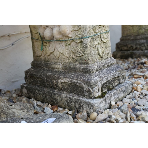 622 - Stone garden seat of curved form, raised on two supports with floral decoration in relief, approx 11... 