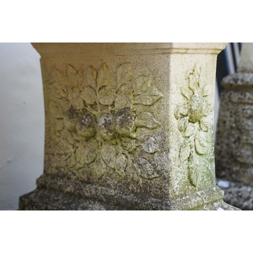 622 - Stone garden seat of curved form, raised on two supports with floral decoration in relief, approx 11... 