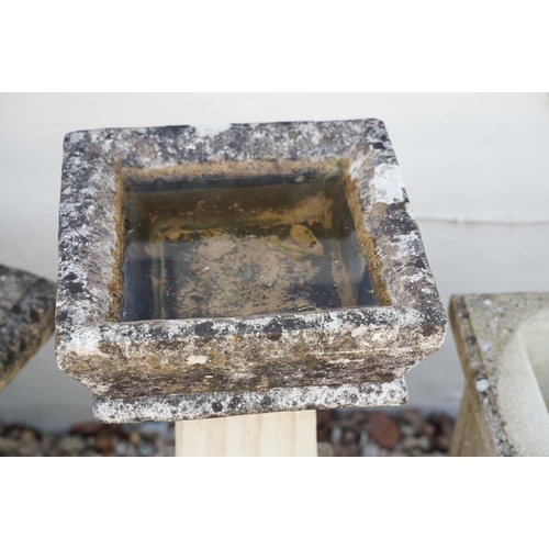 623 - Reconstituted stone bird bath of square form, raised on a column support, measures approx 71cm high,... 