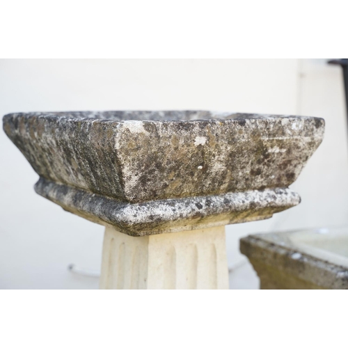 623 - Reconstituted stone bird bath of square form, raised on a column support, measures approx 71cm high,... 