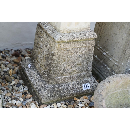 623 - Reconstituted stone bird bath of square form, raised on a column support, measures approx 71cm high,... 