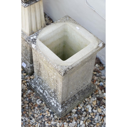 623 - Reconstituted stone bird bath of square form, raised on a column support, measures approx 71cm high,... 