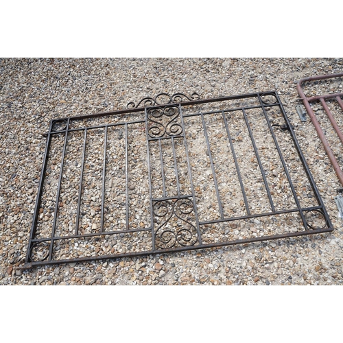 624 - Black painted wrought iron driveway gate (approx 292cm wide), together with a metal garden gate