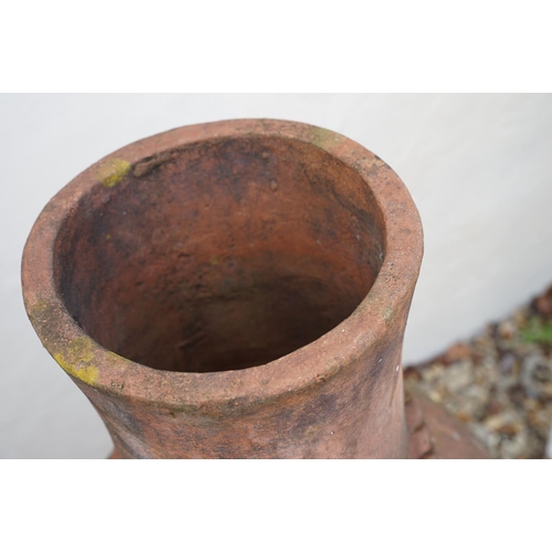 627 - Terracotta patio chimenea, raised on three scrolled wrought iron supports, approx 109cm tall