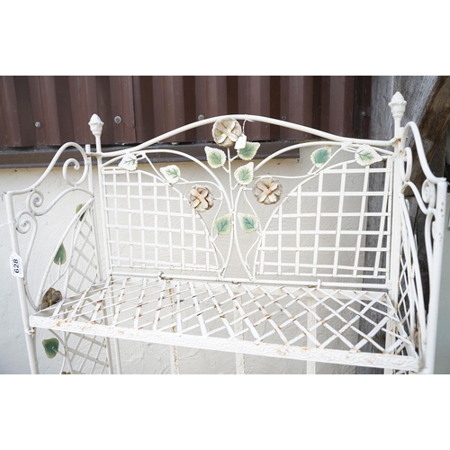 628 - Four shelf metal garden plant stand with ornate flower decoration, approx 163cm high x 670cm wide