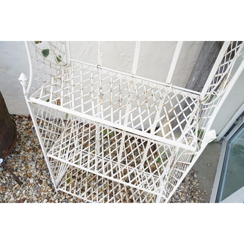 628 - Four shelf metal garden plant stand with ornate flower decoration, approx 163cm high x 670cm wide