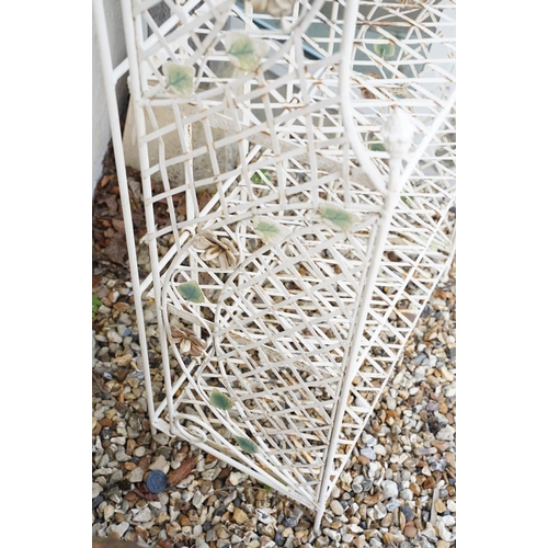 628 - Four shelf metal garden plant stand with ornate flower decoration, approx 163cm high x 670cm wide