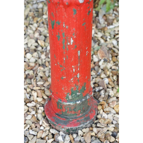 629 - Red painted cast metal four-branch electric streetlight, approx 153cm high